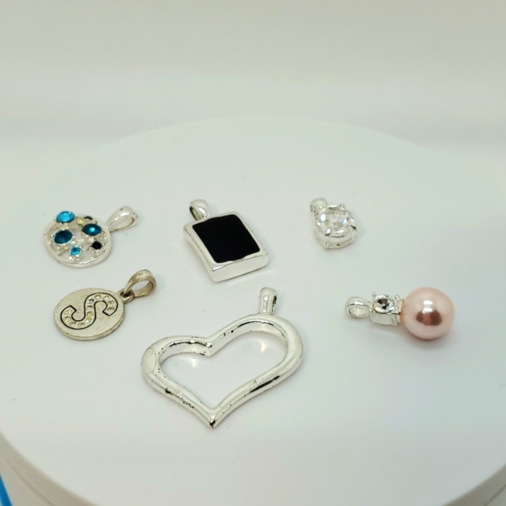 Assorted silvertone pendants